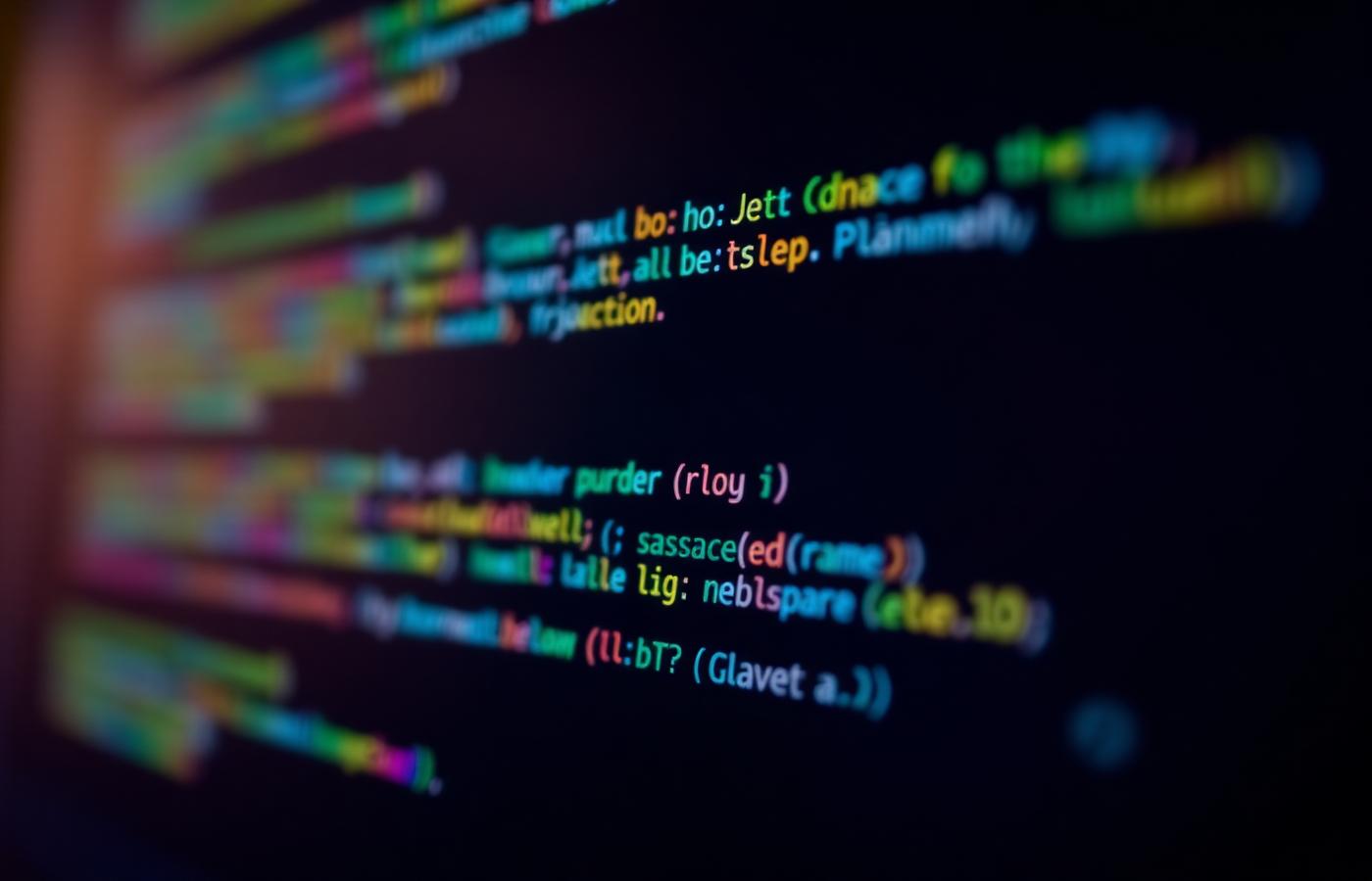 Colourful source code on a dark screen